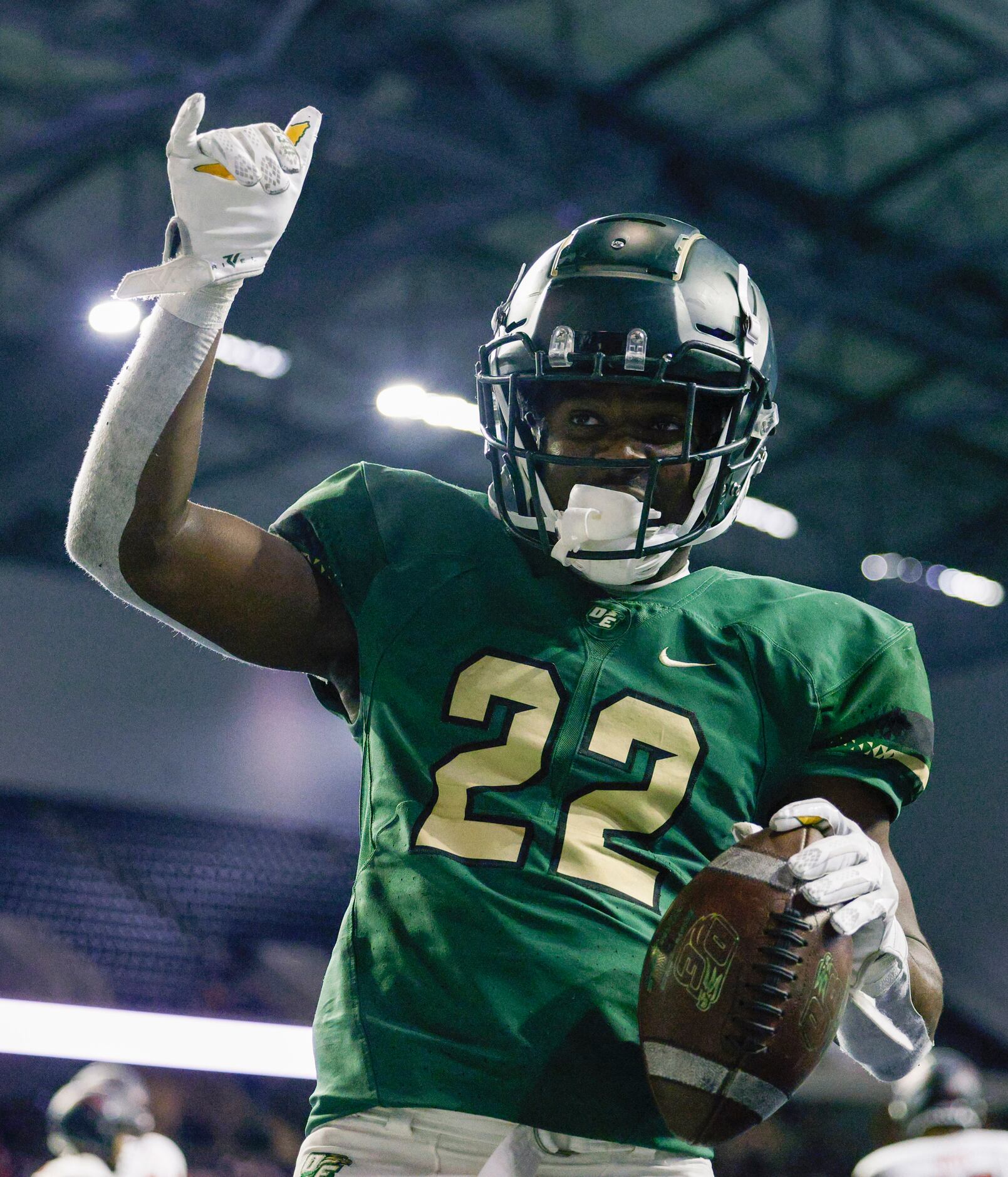 DeSoto’s Deondrae Ride Jr. (22) celebrates after rushing for a touchdown against...
