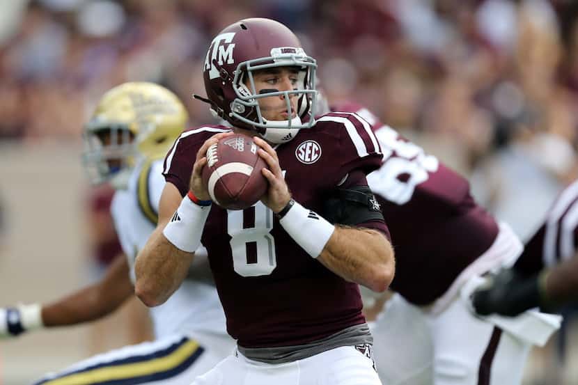 Texas A&M's quarterback Trevor Knight (8) looks to pass during the first quarter of an NCAA...