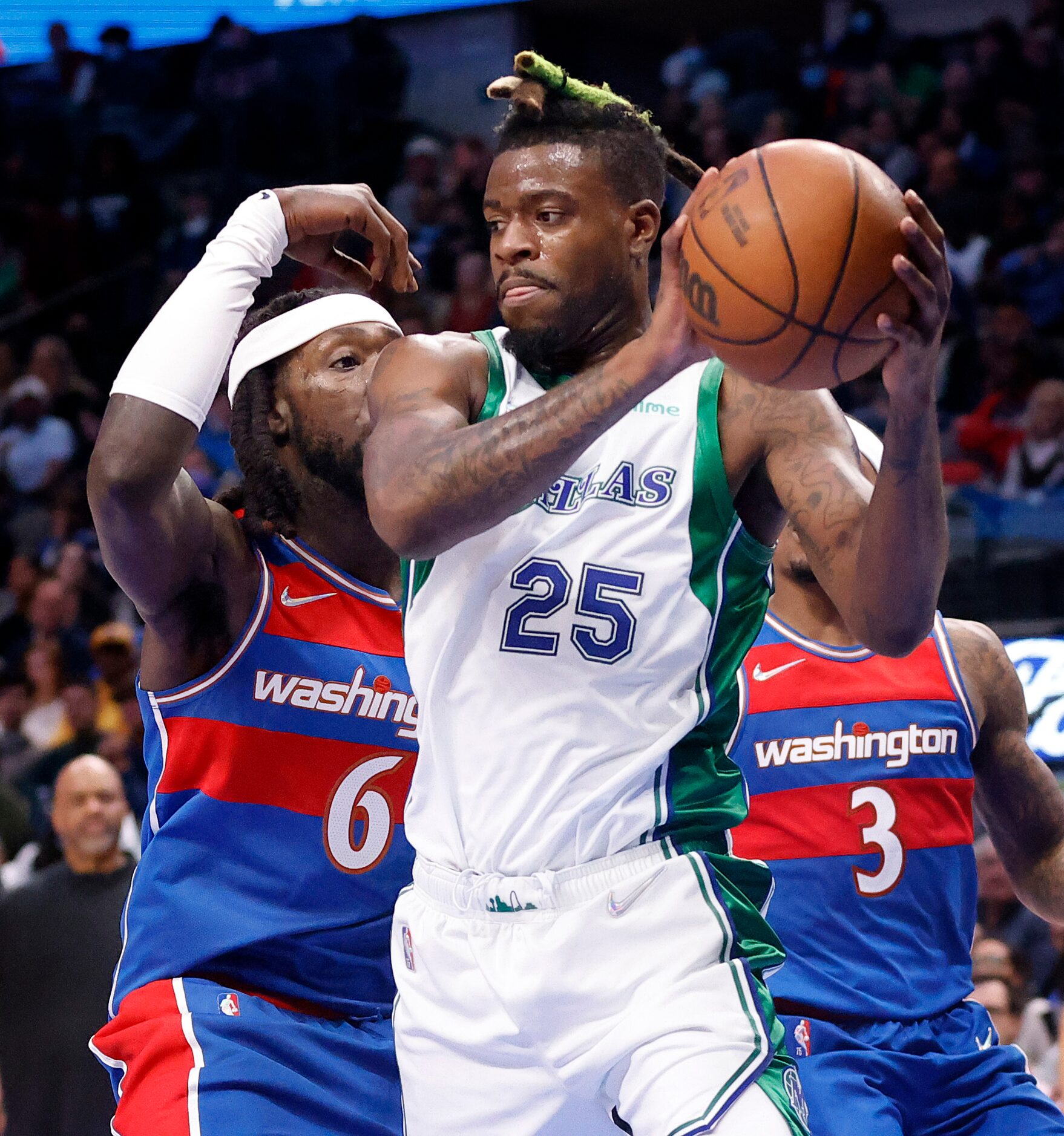 Dallas Mavericks forward Reggie Bullock (25) pulls down an offensive rebound against...