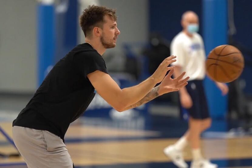 Dallas Mavericks guard Luka Doncic catches the ball during the team's mandatory workout on ...