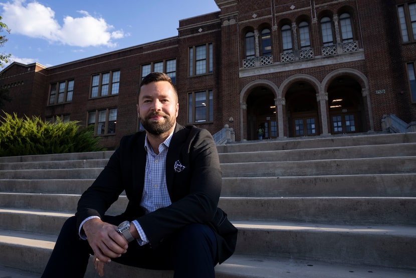 DISD board President Ben Mackey, sitting outside Sunset High School, says, “The kids we’re...