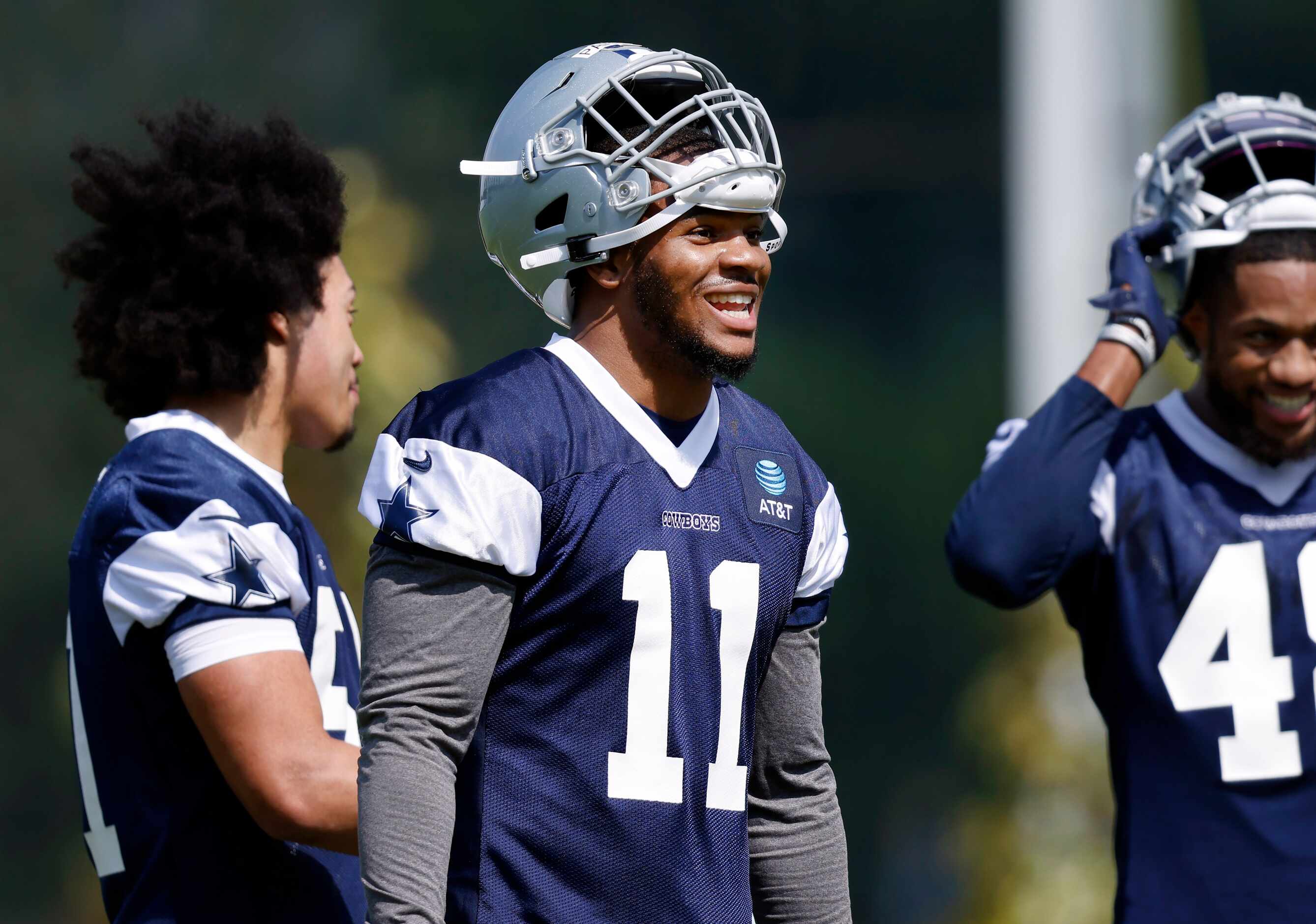 Dallas Cowboys first round linebacker Micah Parsons (11) laughs with teammates during rookie...