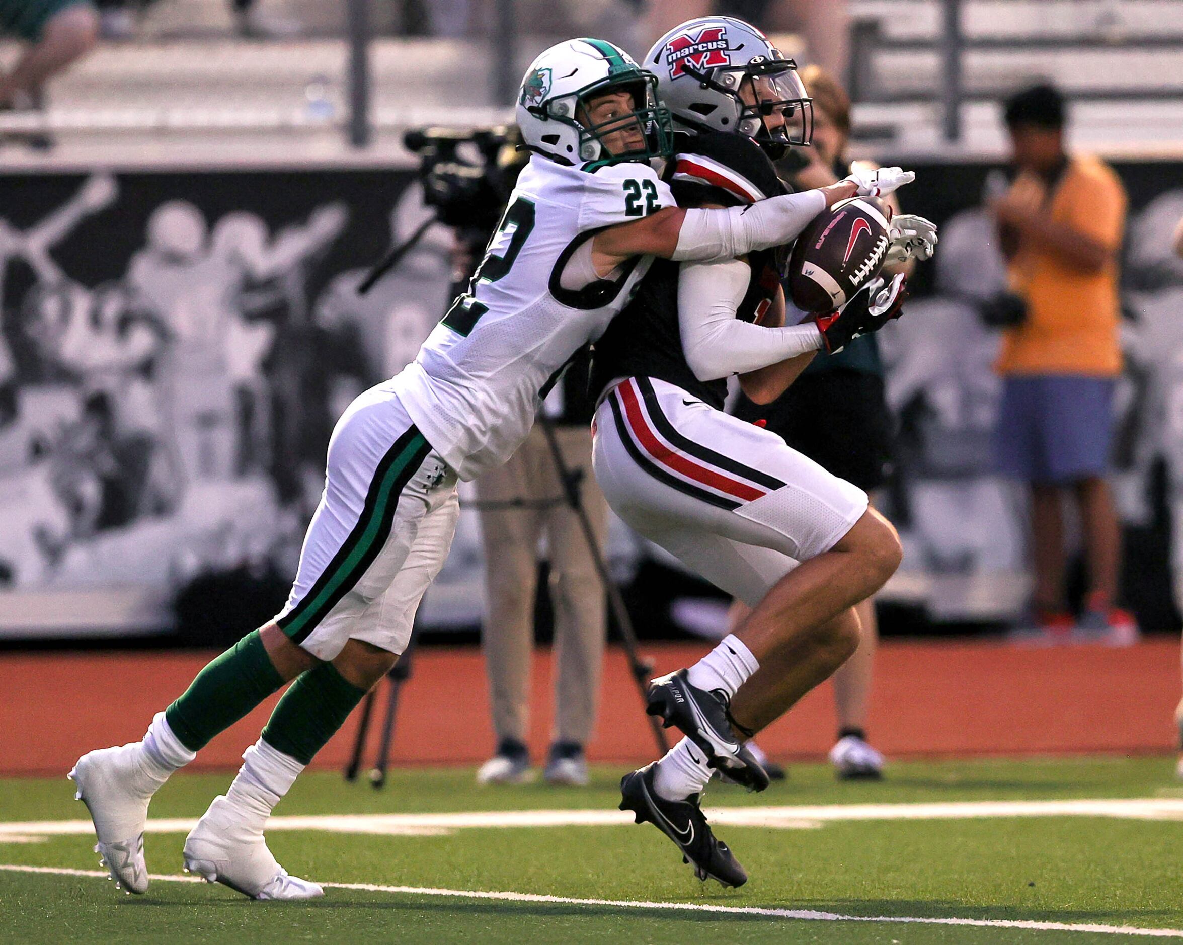 Southlake Carroll defensive back Logan Lewandowski (22) defends on a pass that intended for...