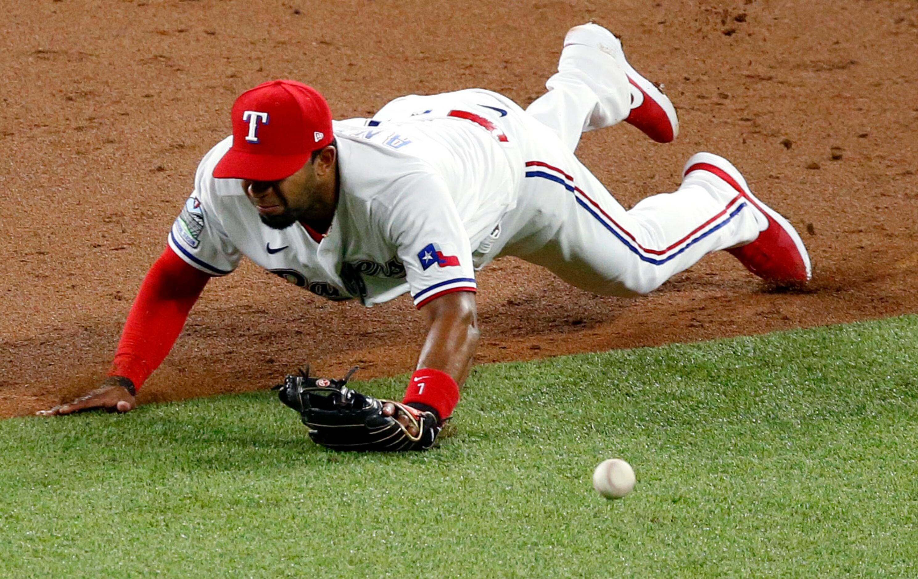 Texas Rangers shortstop Elvis Andrus (1) makes a diving at a base hit by Seattle Mariners...