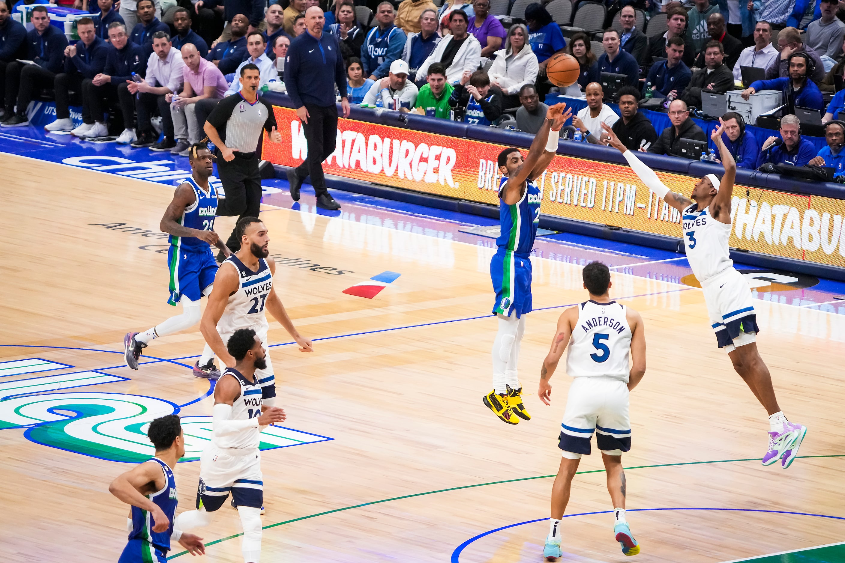 Dallas Mavericks guard Kyrie Irving (2) shoots a 3-pointer over Minnesota Timberwolves...