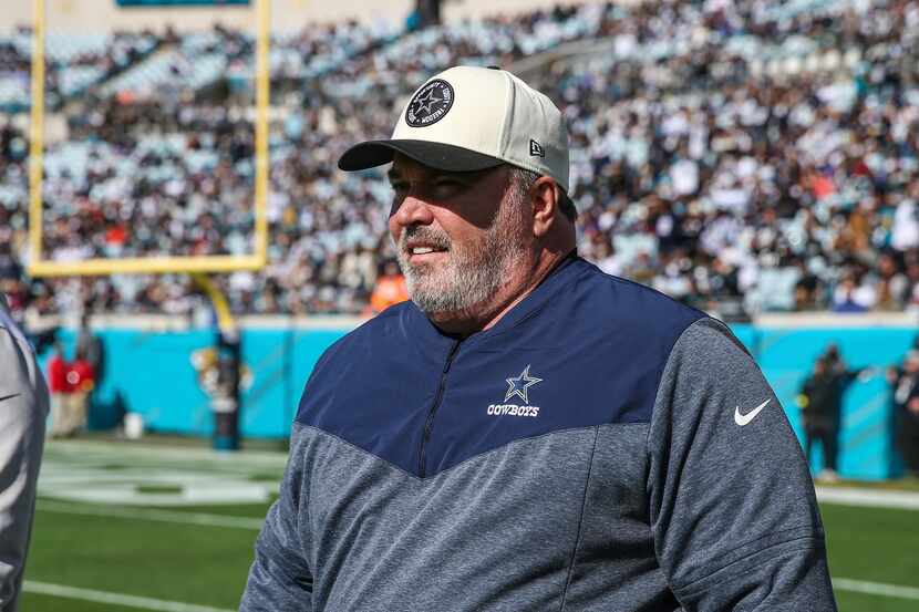 Dallas Cowboys head coach Mike McCarthy walks the field during warm-ups before an NFL...