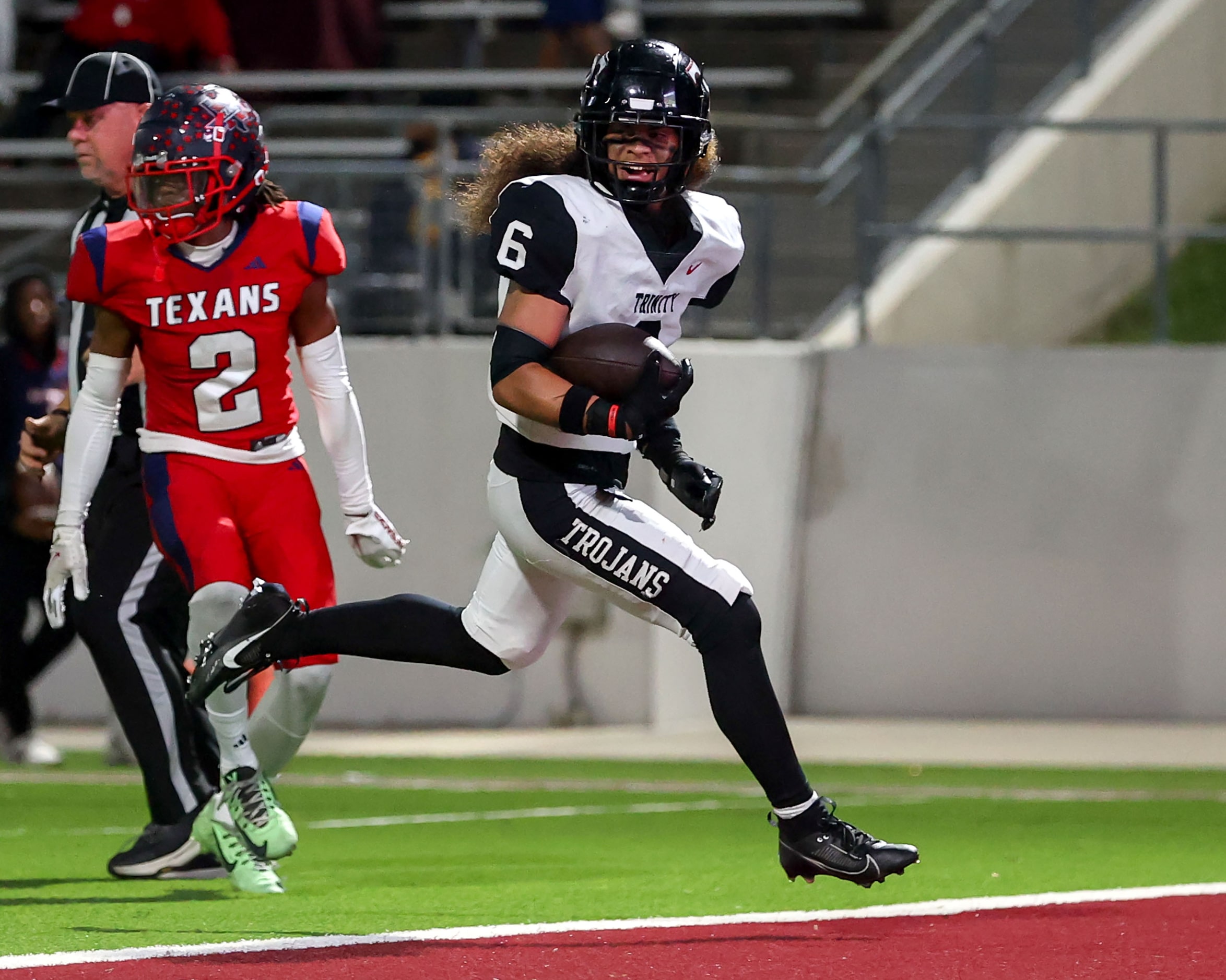 Trinity running back Michael Saafi (6) walks into the endzone for a touchdown run against...