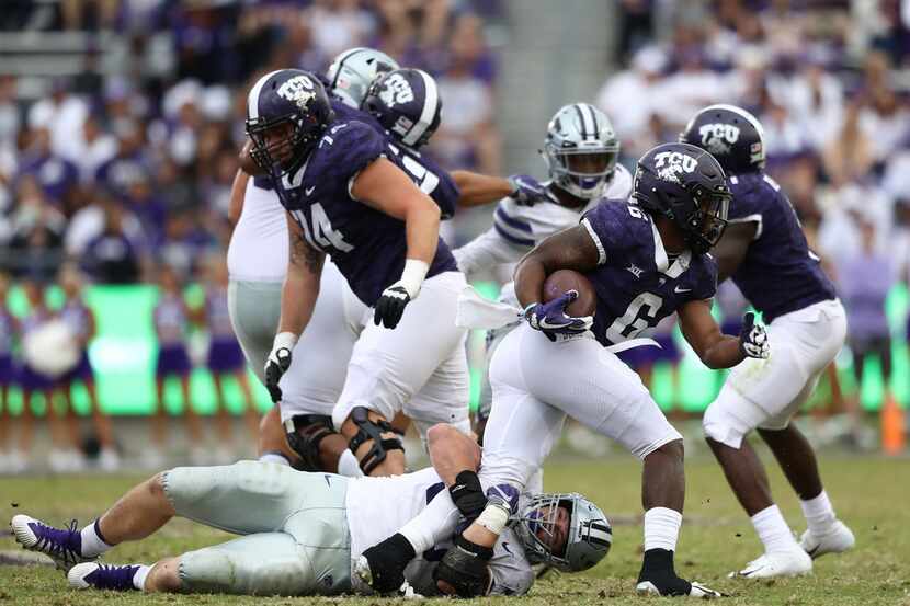 FORT WORTH, TEXAS - NOVEMBER 03:  Darius Anderson #6 of the TCU Horned Frogs is tackled by...