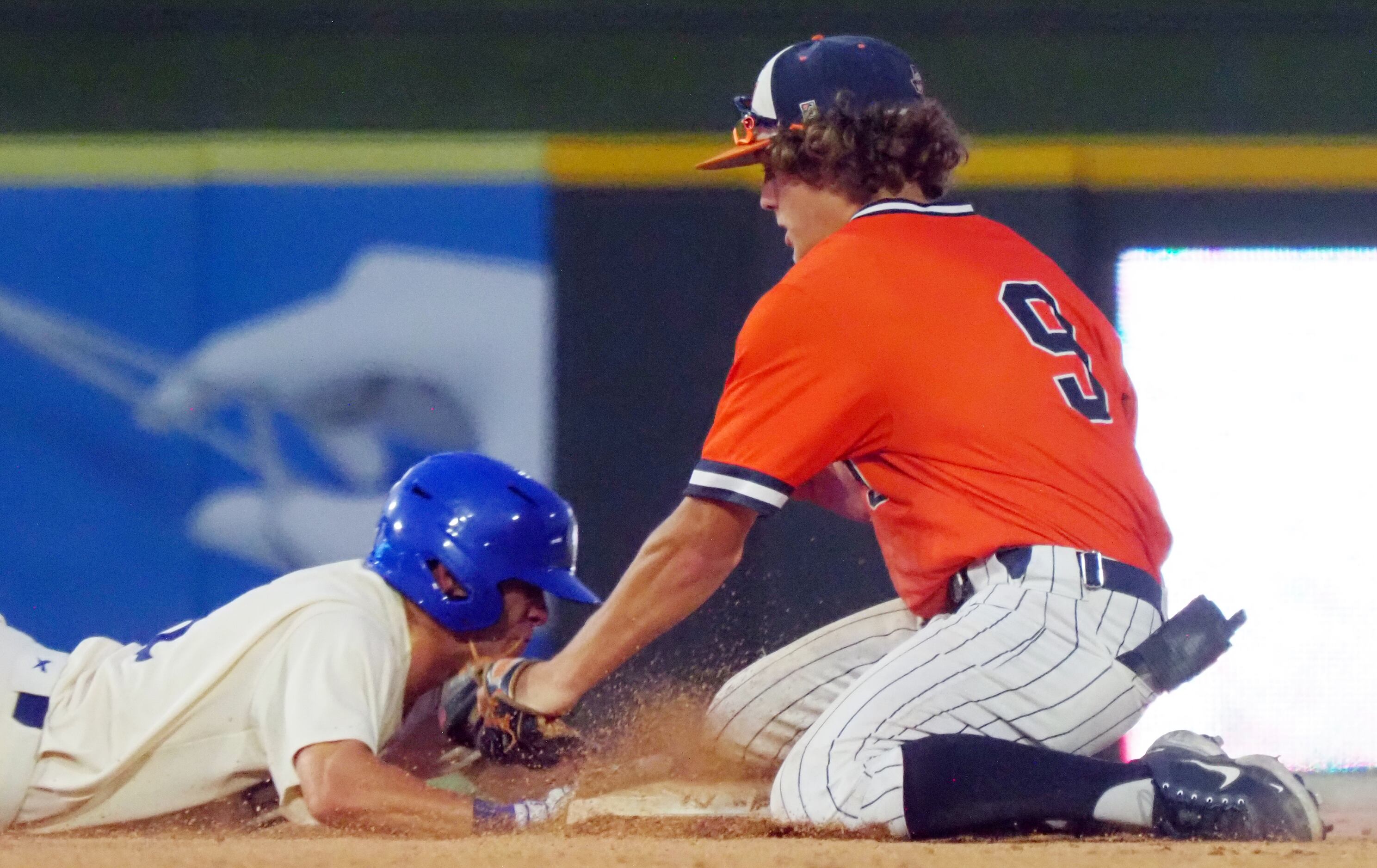 Frisco Wakeland short stop Dylan Snead (right) misses tagging out Georgetown baserunner Eli...