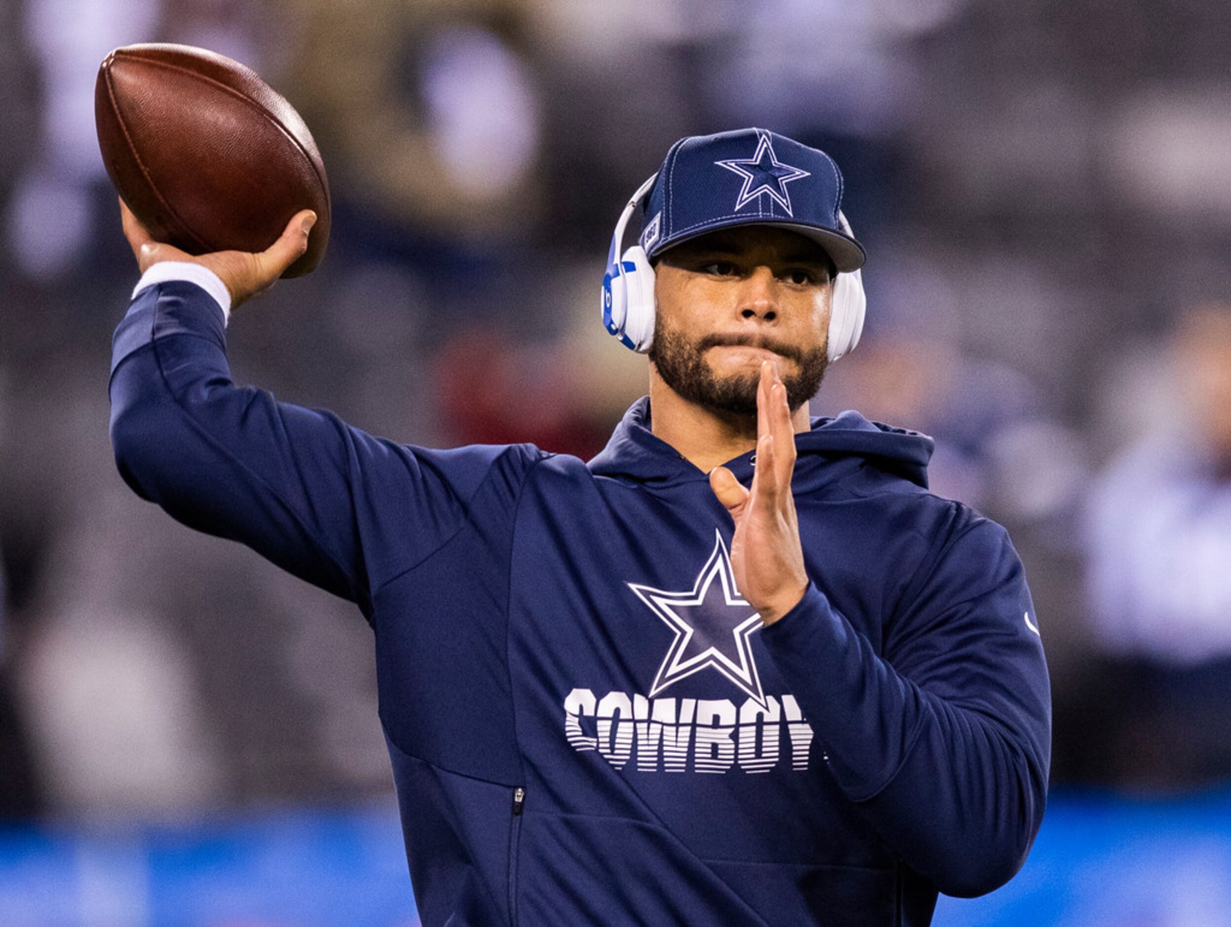 Dallas Cowboys quarterback Dak Prescott (4) warms up before an NFL game between the Dallas...