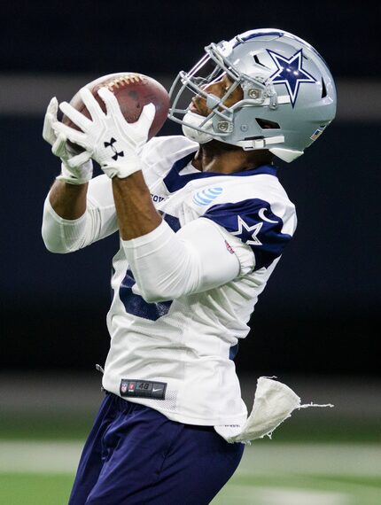 Cowboys wide receiver Randall Cobb (18) catches a pass during OTAs on Wednesday, May 22,...