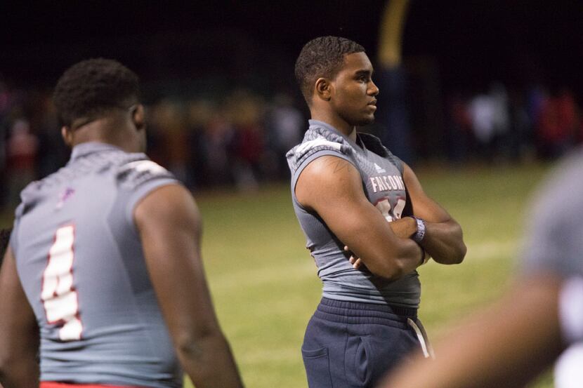 Bishop Dunne running back Rajan Cunningham (33) watches from the sideline with an injury...