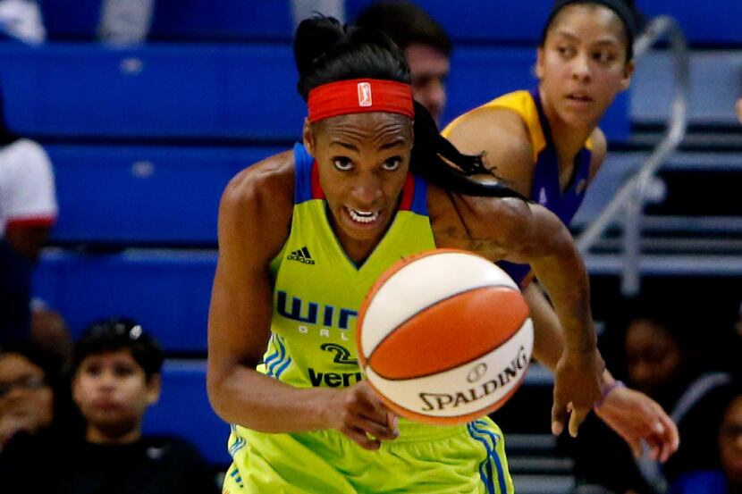 Dallas Wings forward Glory Johnson (25) chases a loose ball during the second half of a WNBA...