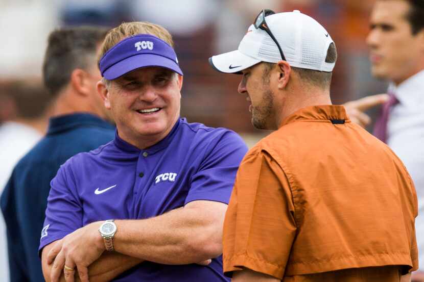 TCU Horned Frogs head coach Gary Patterson greets Texas Longhorns head coach Tom Herman...