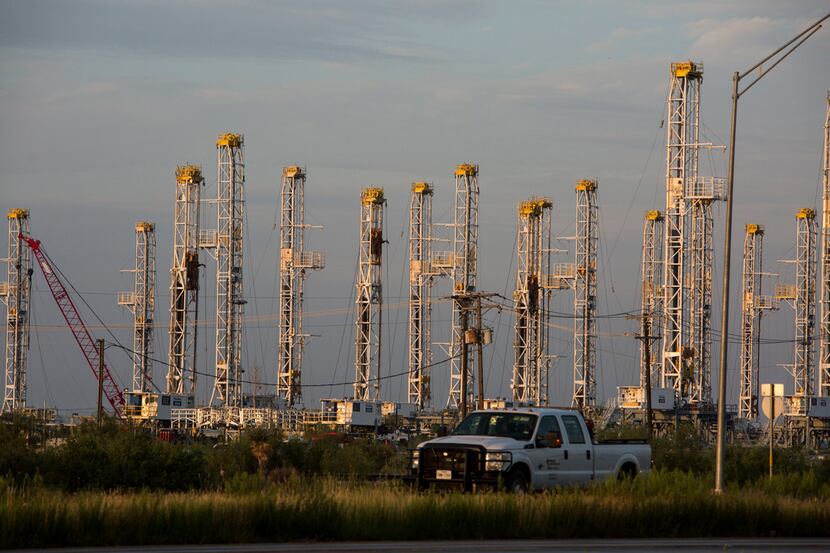 Dozens of rigs stand at a Helmerich & Payne yard in Odessa, Texas.