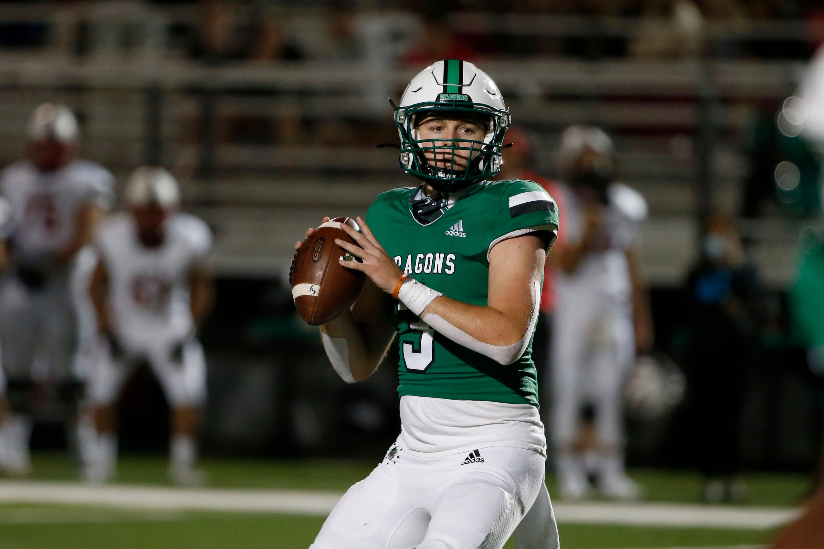 Southlake Carroll quarterback Quinn Ewers (3) looks to pass against Rockwall Heath during...