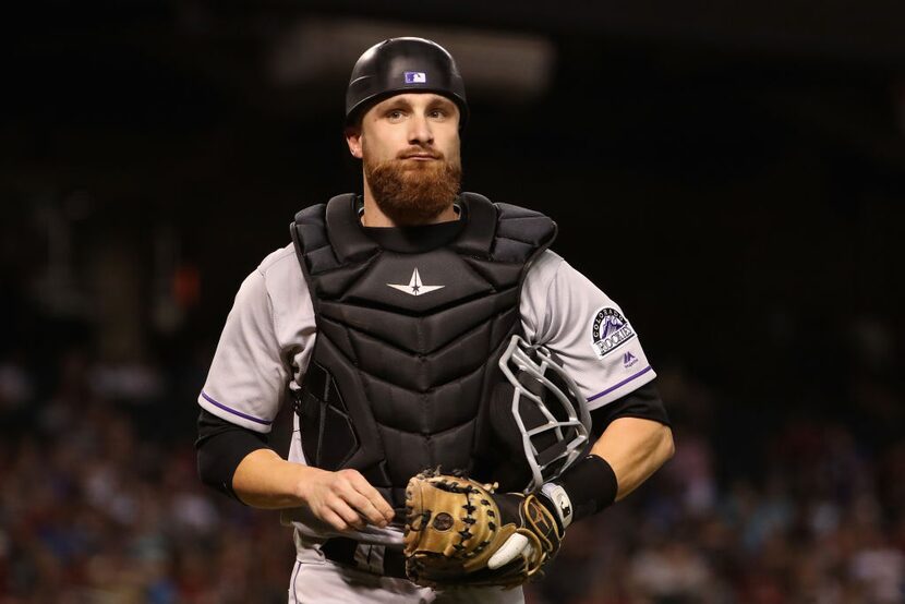 PHOENIX, AZ - SEPTEMBER 12: Catcher Jonathan Lucroy #21 of the Colorado Rockies walks off...