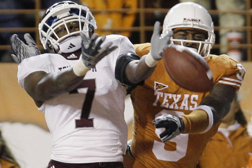 A&M's Uzoma Nwachukwu (7) breaks up a pass intended for Texas' Malcolm Williams (9). The...