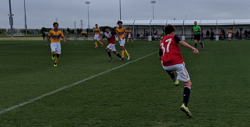 FC Dallas U14 #37 Lucas Siikala traps the ball against Tigres and Diego Hernandez looks on...