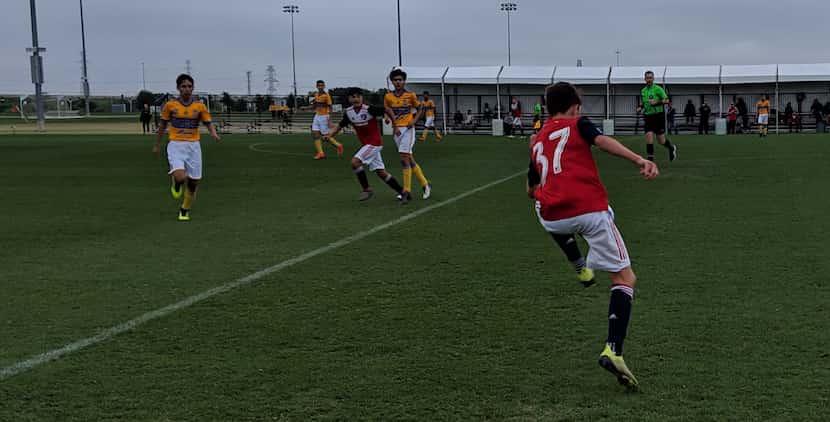 FC Dallas U14 #37 Lucas Siikala traps the ball against Tigres and Diego Hernandez looks on...