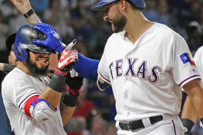 Texas Rangers third baseman Joey Gallo, right, celebrates his fourth-inning homer with...