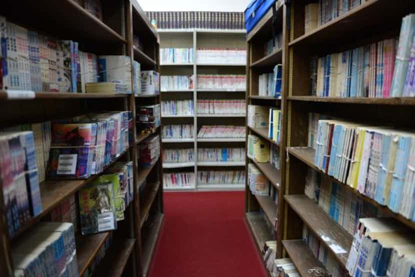 The library at the Dallas Chinese Community Center in Richardson has about 20,000...