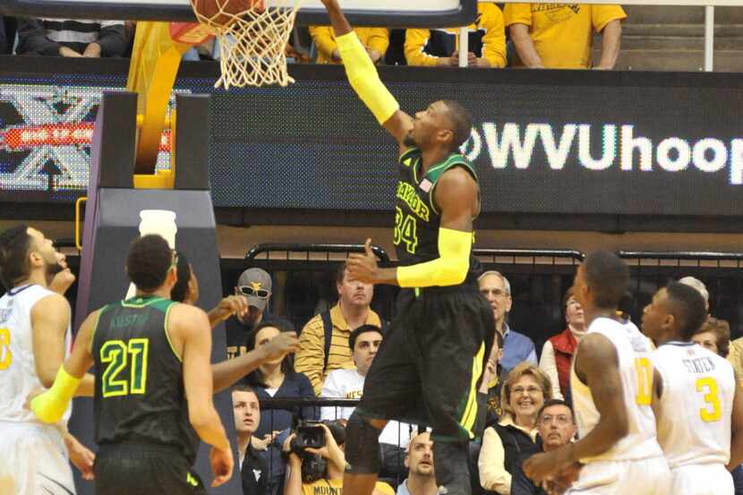 Baylor Bears forward Cory Jefferson getting offensive rebound and putting back up for score...