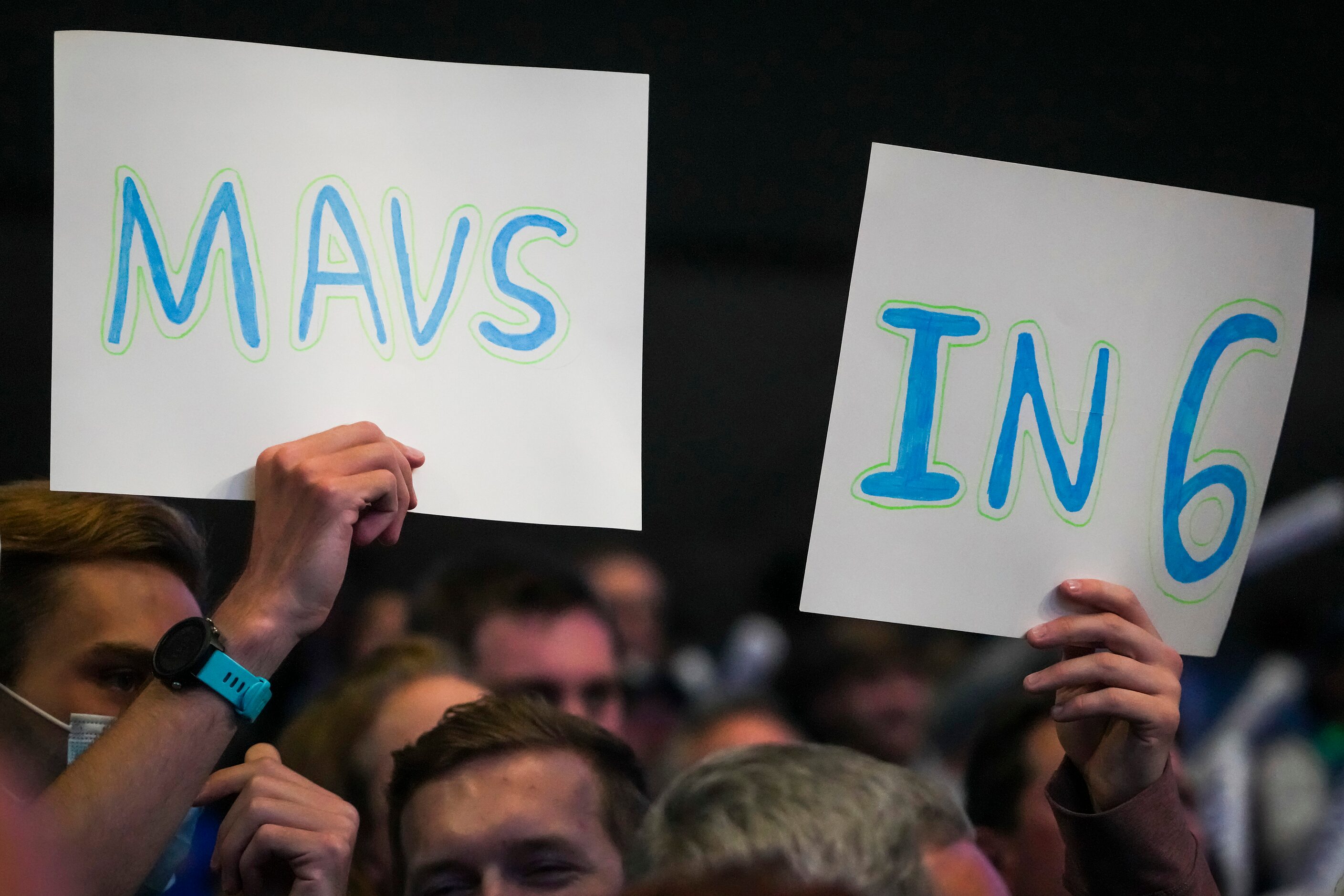 Dallas Mavericks fans cheer as their team warms up before Game 5 of a NBA first round...