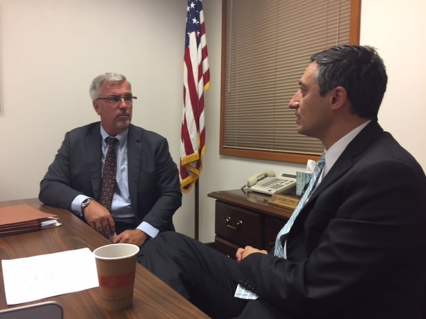 Badger (left) meets with the roofing bill sponsor, State Rep. Giovanni Capriglione,...