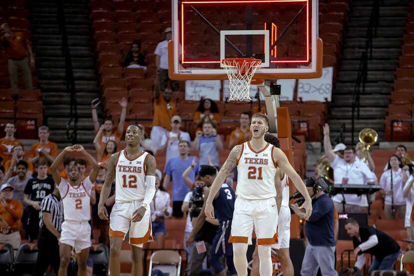 Texas forward Dylan Osetkowski (21) celebrates Texas' 78-76 overtime win over Xavier in an...