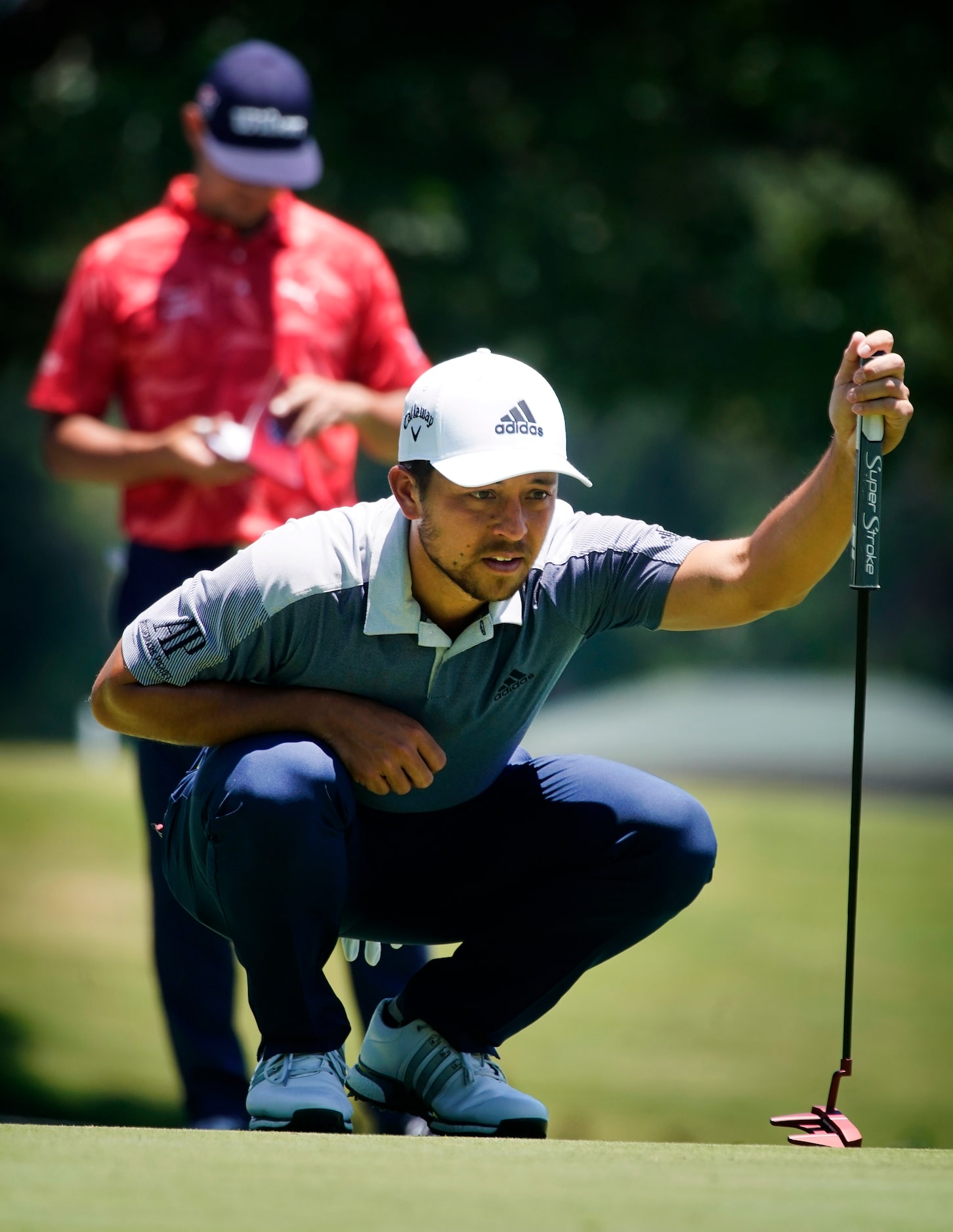 PGA Tour golfer Xander Schauffele
liens up his putt on the second green during the final...