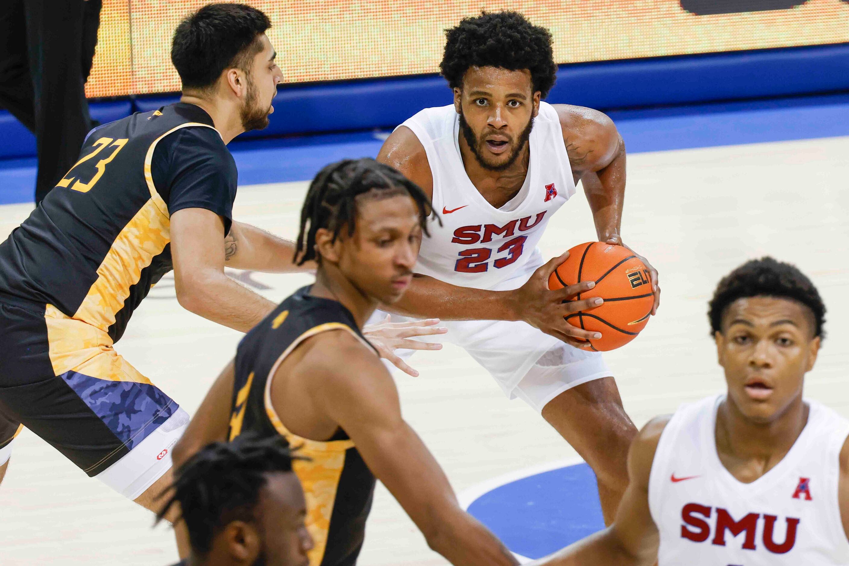 Southern Methodist forward Efe Odigie (23) looks to pass the ball past Texas A&M-Comm’s Alex...