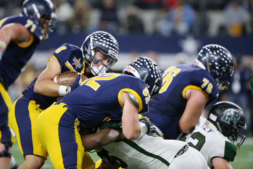 Highland Park rusher Conner Allen (8) is stopped on a play in the first half  during the...