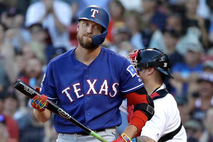 Texas Rangers' Hunter Pence reacts after striking out and leaving runners on, to end the...