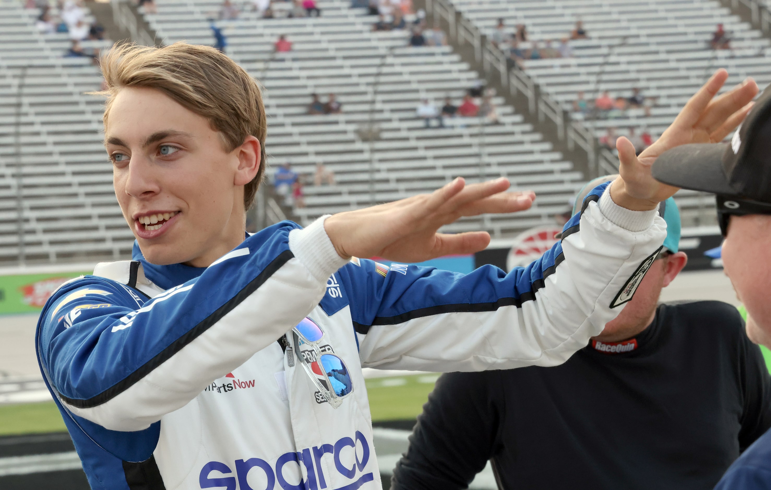 Carson Hocevar , driver of the #42 Sparco Chevrolet visits with race enthusiasts prior to...