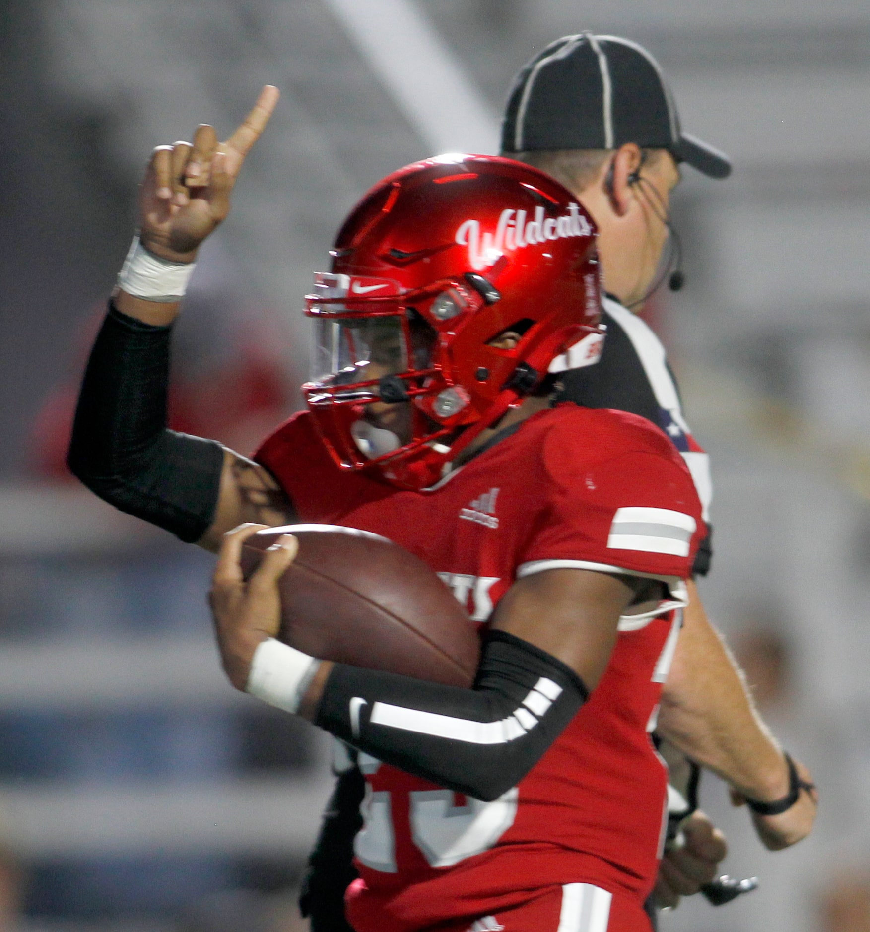 Dallas Woodrow Wilson running back Keitron Pearson (23) gestures after scoring a rushing...