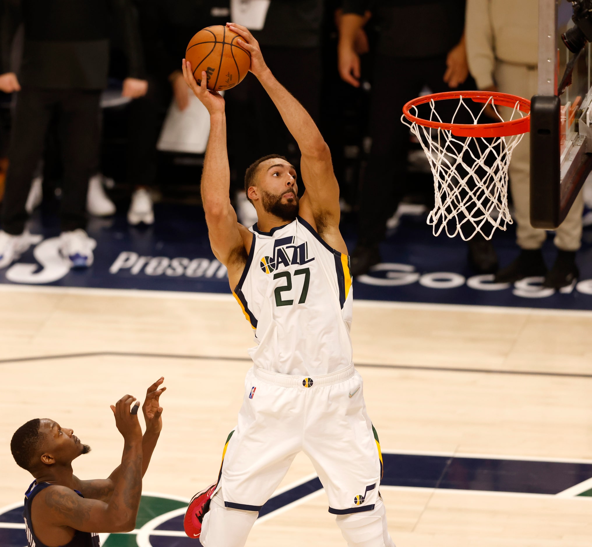 Utah Jazz center Rudy Gobert (27) dunks the ball in front of Dallas Mavericks forward Dorian...