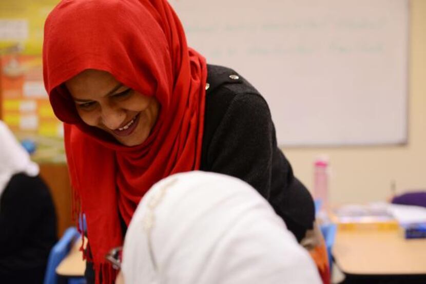 
English teacher Usma Shahi works with a seventh-grader. In January, teachers received STAAR...