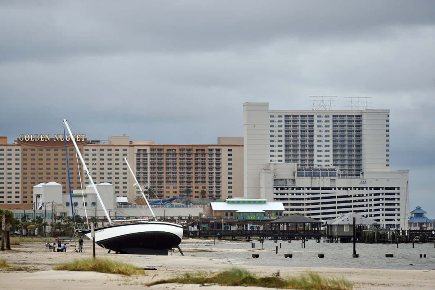 A sail boat is beached near Margaritaville and the Golden Nugget in Biloxi, Miss., Sunday,...