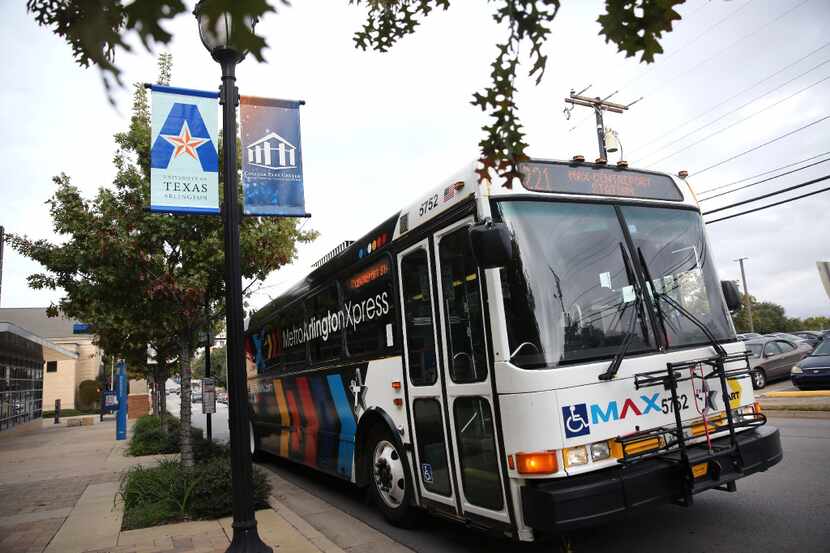 The Metro ArlingtonXpress bus pulls out from College Park Center in Arlington on Nov. 22. 