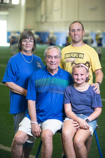 Former Grand Prairie ISD executive  
director of athletics Gary Bartel, second from left,...