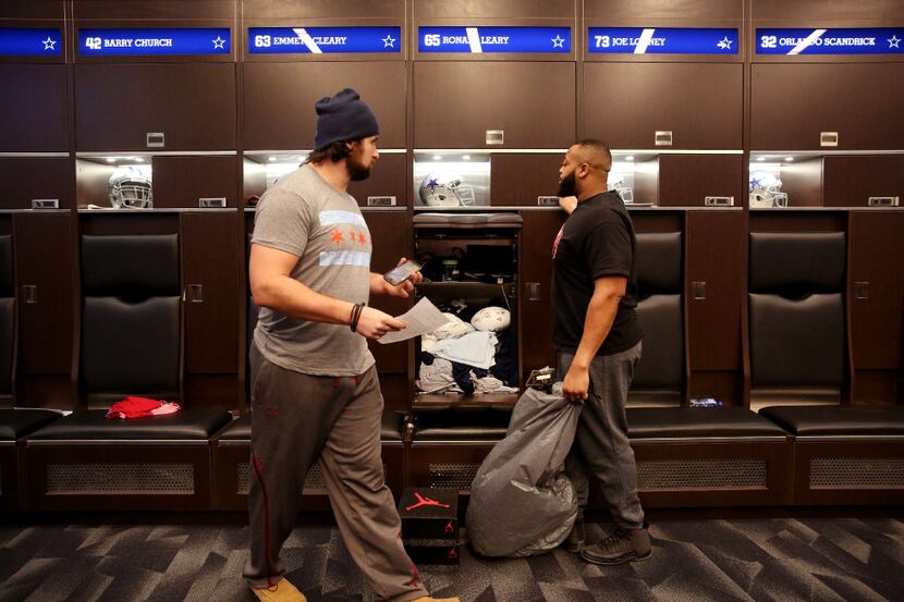 Dallas Cowboys guard Ronald Leary (right) cleans out his locker alongside guard Emmett...