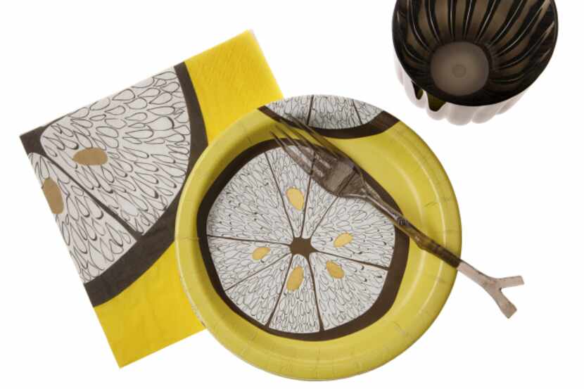 In bright lemon yellow, a luncheon napkin and plate in the Lemonwood pattern bring fun to an...