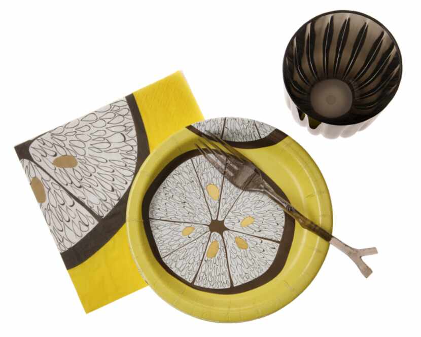 In bright lemon yellow, a luncheon napkin and plate in the Lemonwood pattern bring fun to an...
