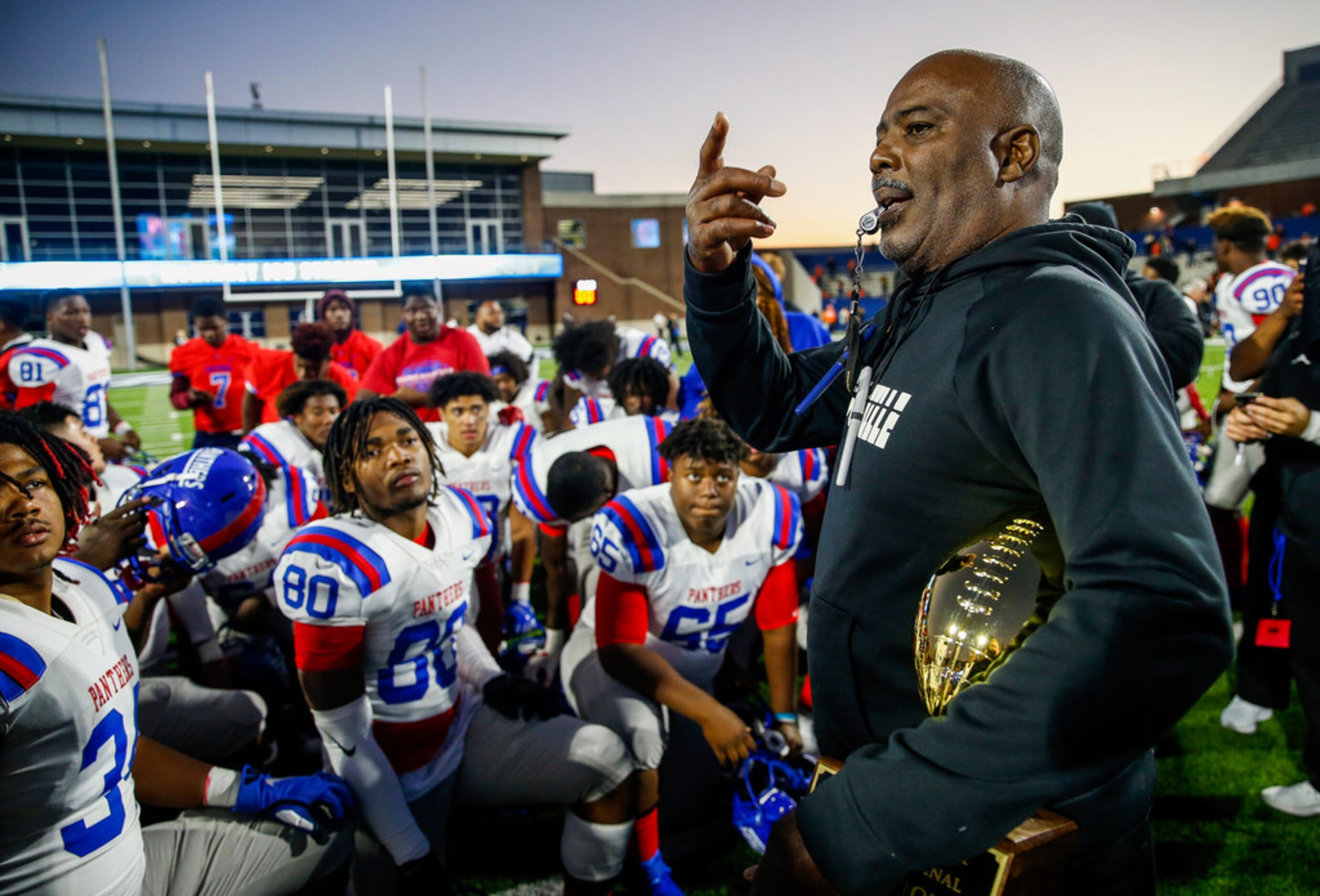 Duncanville Panthers head coach Reginald Samples speaks to his team after a win over...