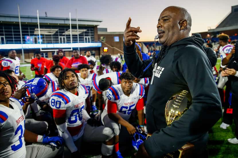 Duncanville coach Reginald Samples speaks to his team after a win over Rockwall in a Class...