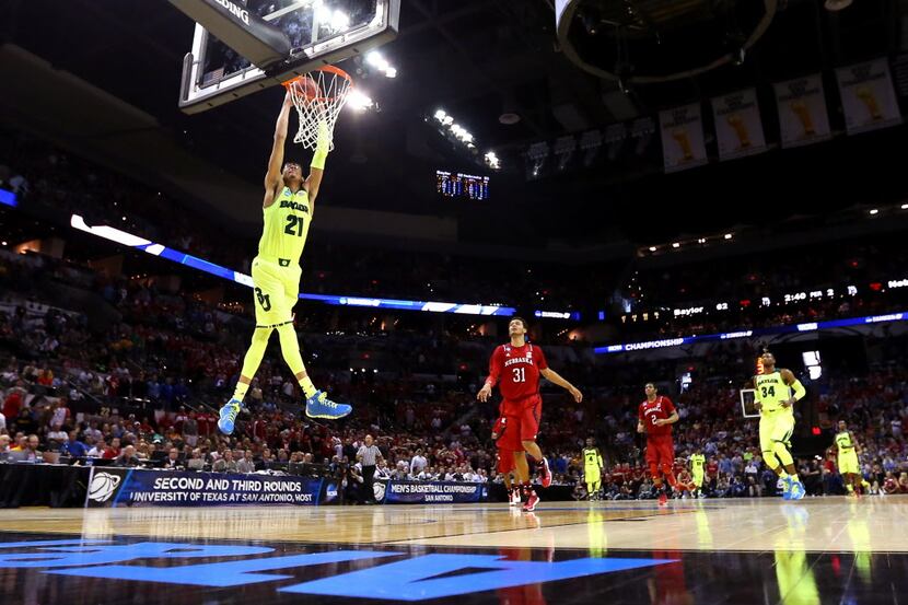 SAN ANTONIO, TX - MARCH 21:  Isaiah Austin #21 of the Baylor Bears dunks in the second half...