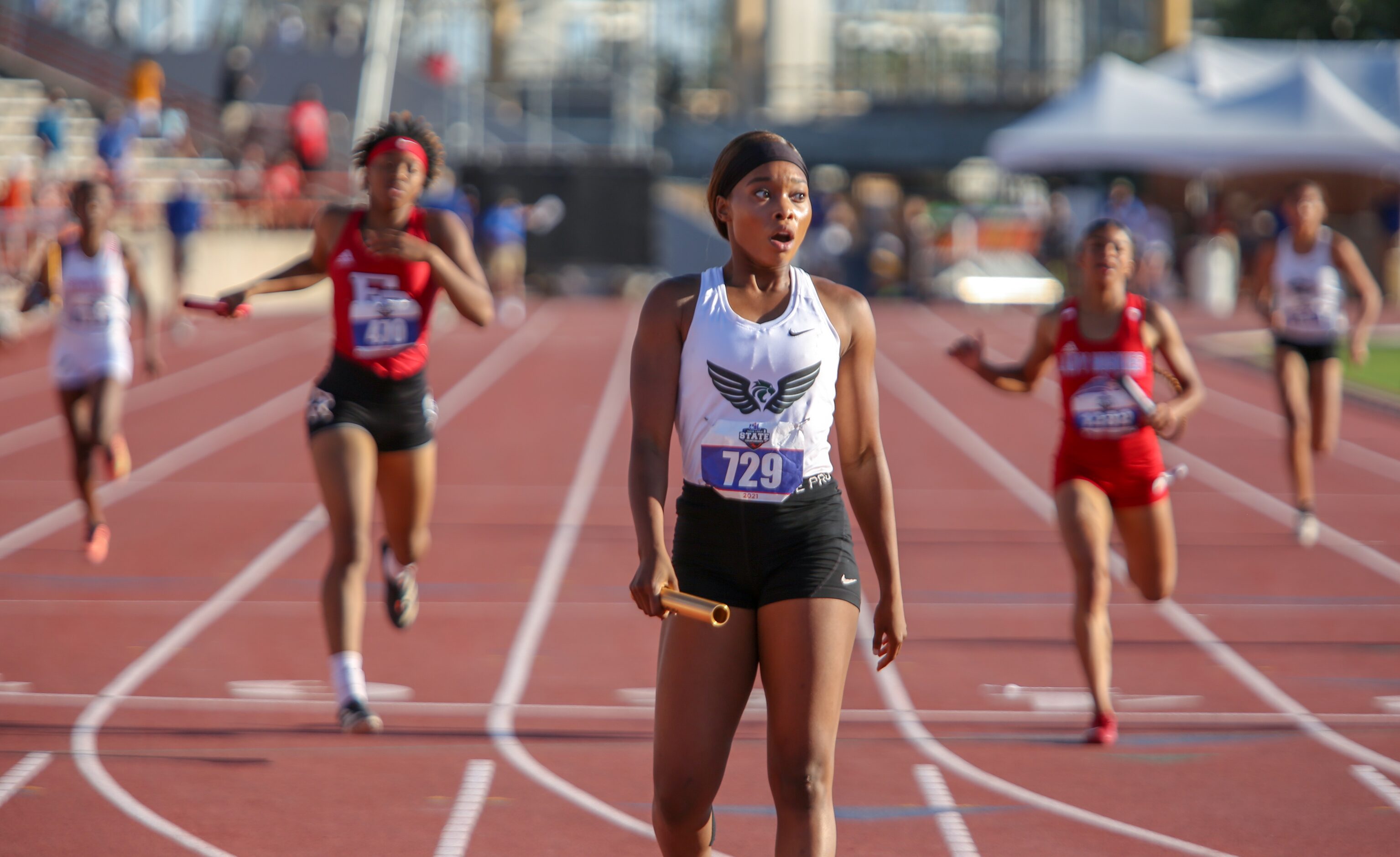 Kennedale's Brianna Brand reacts after placing first during the 4A girls 4x200 relay event...