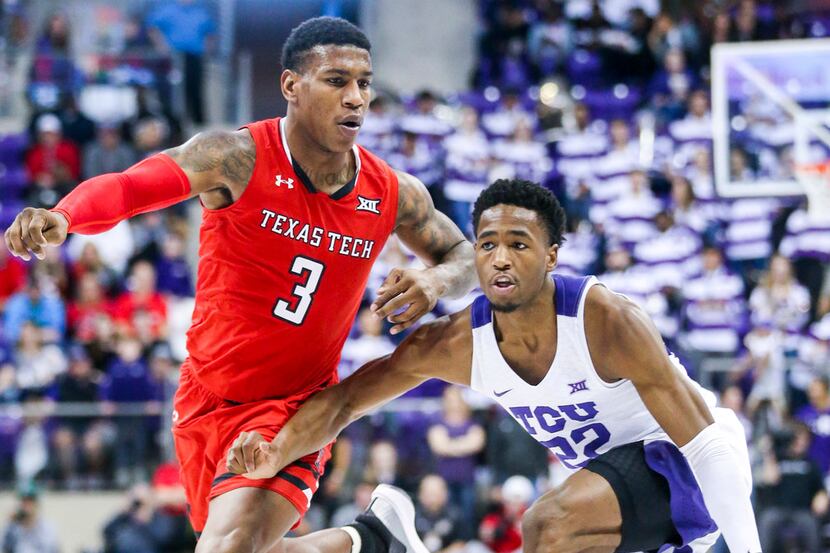 TCU Horned Frogs guard RJ Nembhard (22) drives the ball past Texas Tech Red Raiders forward...