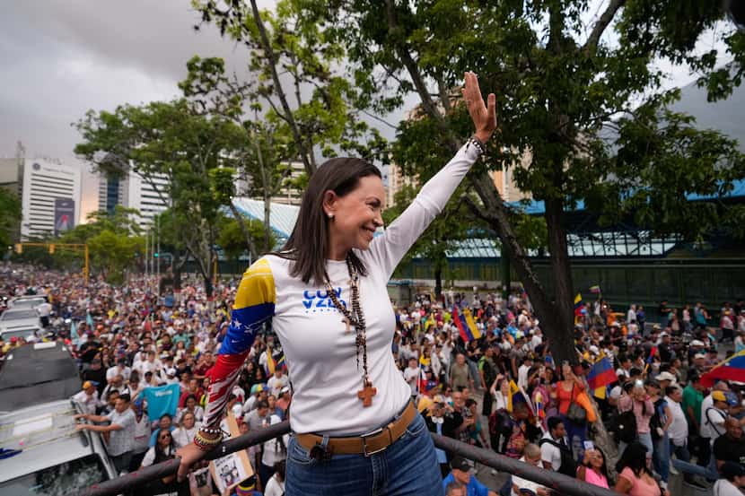 Opposition leader María Corina Machado waves during a rally launching the official...
